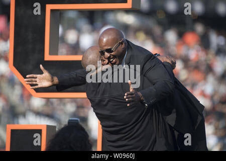 Former San Francisco Giants player Barry Bonds (R) is lifted up by former Pittsburgh Pirates teammate Bobby Bonilla at a ceremony to retire Bonds' jersey number before a baseball game between the Giants and the Pirates in San Francisco on August 11, 2018.      Photo by Terry Schmitt/UPI Stock Photo