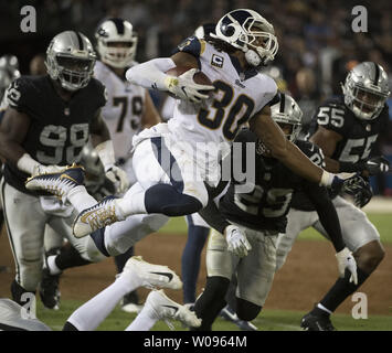 Los Angeles Rams Todd Gurley II is tackled n the third quarter against the Oakland Raiders at the Coliseum in Oakland, California on Monday, September 10, 2018. The Rams defeated the Raiders 33-13.       Photo by Terry Schmitt/UPI Stock Photo