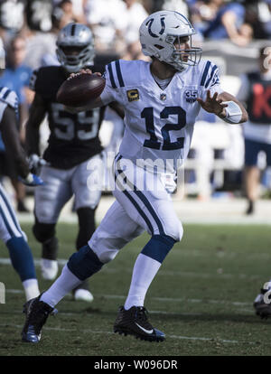 Indianapolis Colts QB Andrew Luck (12) rolls out to pass against the Oakland Raiders in the second quarter at the Coliseum Oakland, California on October 28, 2018. The Colts defeated the Raiders 42-28.         Photo by Terry Schmitt/UPI Stock Photo