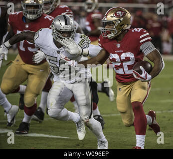 Los Angeles, USA. October 07, 2018 Los Angeles Chargers running back Melvin  Gordon (28) carries the ball as Oakland Raiders linebacker Tahir Whitehead  (59) makes the tackle during the football game between