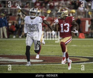 San Francisco 49ers wide receiver Pierre Garcon (15) romps toward the  endzone unmolested on a 24 yard pass from quarterback Nick Mullens (4) in  the first quarter against the Oakland Raiders at