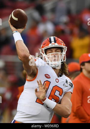 Clemson quarterback Trevor Lawrence warms up before the start of an ...