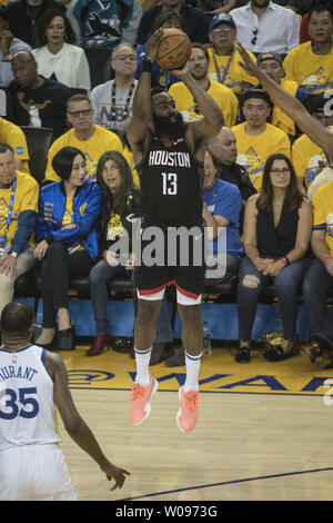 Houston Rockets guard James Harden (13) lputs up a three point shot against the Golden State Warriors in the first quarter of game one of the Western Conference Semi-Finals of NBA Playoffs at Oracle Arena in Oakland, California on April 28, 2019.      Photo by Terry Schmitt/UPI Stock Photo