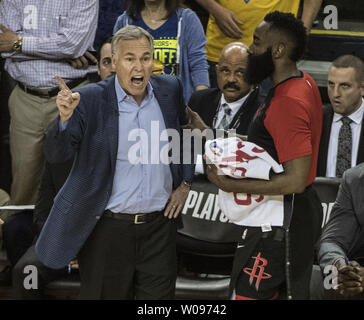 Houston Rockets guard James Harden (R)  attempts to calm head coach Mike D'Antoni yells at an official after he was given a technical foul in the second half against the Golden State Warriors in game one of the Western Conference Semi-Finals of NBA Playoffs at Oracle Arena in Oakland, California on April 28, 2019. The Warriors defeated the Rockets 104-100.     Photo by Terry Schmitt/UPI Stock Photo