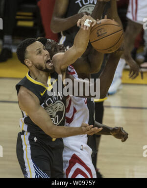 Golden State Warriors guard Stephen Curry (30) blocks a shot by Houston Rockets center Clint Capela (15) in the first half of game two of the Western Conference Semi-Finals of NBA Playoffs at Oracle Arena in Oakland, California on April 30, 2019. The Warriors defeated the Rockets 115-109 to take a 2-0 lead in the series.    Photo by Terry Schmitt/UPI Stock Photo