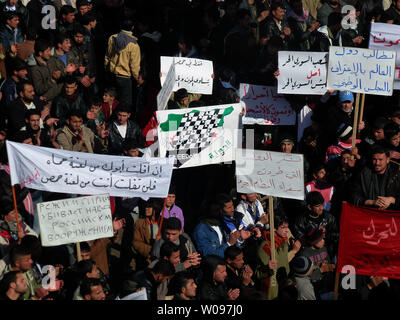 Demonstrators gather during a protest against Syria's President Bashar al-Assad, in Hula, near Homs, in February 13, 2012. Syrian forces resumed their bombardment of the city of Homs on Monday after Arab countries called for U.N. peacekeepers and pledged their firm support for the opposition battling President Bashar al-Assad. UPI.. Stock Photo