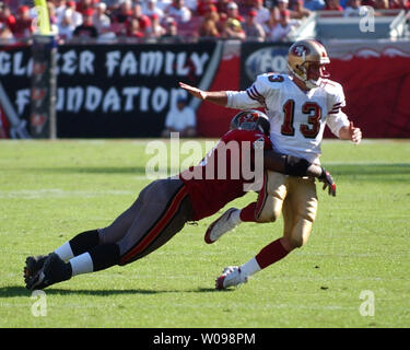 San Francisco 49ers quarterback Tim Rattay is tackled by St. Louis Rams ...