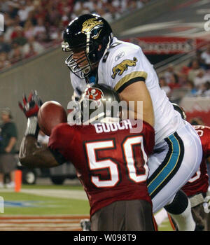 Jacksonville Jaguars tight end Kyle Brady gets a cool drink during