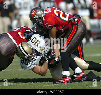 Tampa Bay Buccaneers' linebacker Shelton Quarles (53) tackles Seattle  Seahawks' running back Shaun Alexander as Seahawks' tight end Jerramy  Stevens (86) blocks Buccaneers' defensive end Greg Spires (94) at Raymond  James Stadium