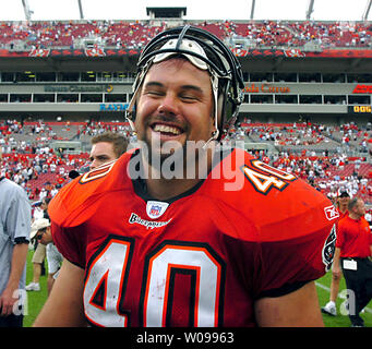 Tampa Bay Buccaneers great Mike Alstott's first game jersey, left, along  side of his last game jersey, are displayed during a special tribute during  the half time of an NFL football game