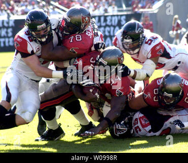 Tampa Bay Buccaneers' running back Earnest Graham (34) advances the ball as the Atlanta Falcons' defense tries to stop him at Raymond James Stadium in Tampa, Florida on December 16, 2007. The Buccaneers beat the Falcons 37-3 clinching a spot in the playoffs and winning the NFC South Championship.     (UPI Photo/John Stuper). Stock Photo