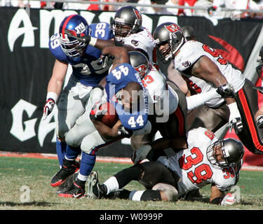 Tampa Bay Buccaneers' Jermaine Phillips (25) and Chris Hovan (95) celebrate  Phillips interception off Arizona Cardinals quarterback Kurt Warner late in  the the fourth quarter of a NFL football game Sunday, Nov.