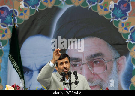 Iranian President Mahmoud Ahmadinejad speaks in front of the pictures of Iran's late leader Ayatolah Khomeini (L) and Iran's current Leader Ayatolah Khamenei  during the 32nd  anniversary of the Islamic Revolution in Tehran, Iran on February 11, 2011.     UPI/Maryam Rahmanian. Stock Photo