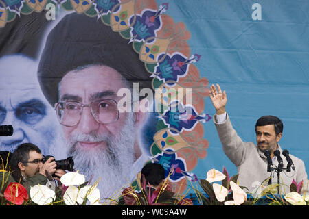 Iranian President Mahmoud Ahmadinejad speaks in front of the pictures of Iran's late leader Ayatolah Khomeini (L) and Iran's current Leader Ayatolah Khamenei  during the 32nd  anniversary of the Islamic Revolution in Tehran, Iran on February 11, 2011.     UPI/Maryam Rahmanian. Stock Photo