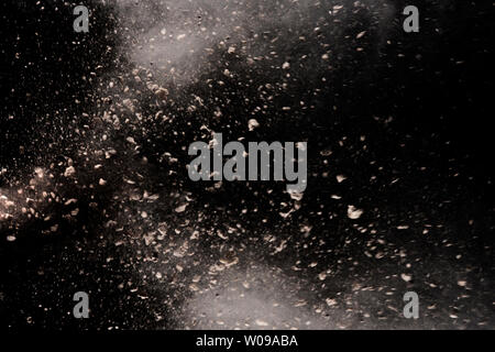 abstract powder splatted background, Freeze motion of earth dust exploding texture Stock Photo