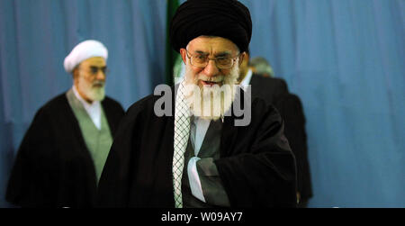 Iran's Supreme Leader Ayatollah Khamenei walks to a polling station in Tehran, Iran on May 4, 2012. Iranians started voting in the second round of the ninth parliamentary election since the Islamic Revolution in 1979.  Photo from official Leader's website.   UPI Stock Photo