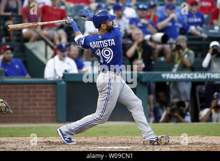 Toronto Blue Jays' Jose Bautista hits a three-run home run against the Texas Rangers in the ninth inning of game 1 of the American League Division Series at Globe Life Park in Arlington, Texas on October 6, 2016. Toronto defeated Texas 11-1.  Photo by Mike Stone/UPI Stock Photo