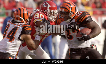 Cincinnati Bengals running back Rudi Johnson looks to fend off a tackle  against the Denver Broncos in the first quarter at Invesco Field at Mile  High in Denver December 24, 2006. (UPI