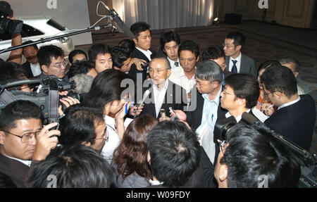 Katsuaki Watanabe, president of Toyota Motor Corporation, answers reporters' questions after a press conference in Tokyo, Japan, on September 26, 2007, in which a new model 'Mark X Zio', available only in Japanese market, was announced. (UPI Photo/Keizo Mori) Stock Photo