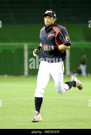 Combined photo shows Japanese outfielder Ichiro Suzuki of the Miami Marlins  wearing different T-shirts during the Major League Baseball club's spring  training in Jupiter, Florida, in 2015. The T-shirt on the bottom