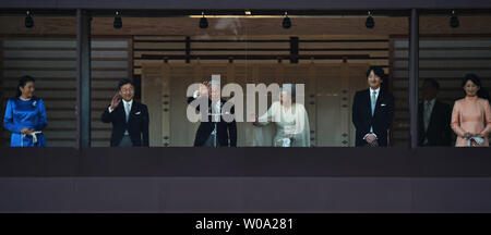 Japan's Emperor Akihito(L3) waves to well-wishers with Empress Michiko(L4), Crown prince Naruhito(L2), Crown princess Masako(L), Prince Akishino (R2), his wife Princess Kiko(R) during a new year greeting at the East Plaza, Imperial Palace in Tokyo, Japan, on January 2, 2017.     Photo by Keizo Mori/UPI Stock Photo