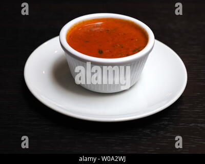 June 2019 - Home Made Red Pepper Sauce With Minced Green Chillies Stock Photo