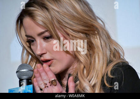 Actress Amber Heard attends the promotional event for the film "Aquaman
