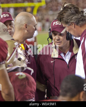 Florida State head coach Jimbo Fisher checks on his first string quarterback EJ Manuel after the quarterback was injured against Oklahoma Sooner in the 2nd half of their NCAA football game in Tallahassee, Florida Sept 17, 2011.  Manuel did not return to the game.  The Oklahoma Sooners defeated the Florida State Sminoles 23-13.  UPI/Mark Wallheiser Stock Photo