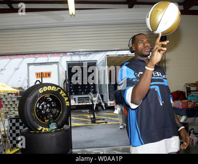 Cleveland Cavaliers basketball star LeBron James spins a basketball as he films an interview while visiting a garage at Bristol Motor Speedway before the start of the NASCAR Nextel Cup Series Sharpie 500  in Bristol, TN on August 27, 2005.  (UPI Photo/Nell Redmond) Stock Photo