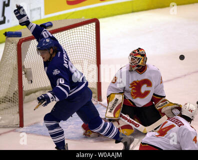 Calgary Flames goalie Jamie McLennan makes one of several