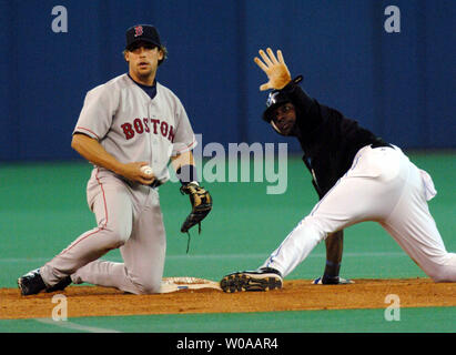 Boston Red Sox's Mark Bellhorn (12) tags out Chicago Cubs' Aramis Ramirez  (16) after he tried to strech a single into a double. The Chicago Cubs  defeated the Boston Red Sox 14-6