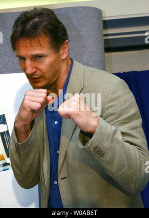 Liam Neeson strikes a pose for photographers at the press conference for 'Kinsey' at the Four Seasons Hotel during the Toronto International Film Festival September 13, 2004 in Toronto, Canada. 'Kinsey' had its world premiere screening at the Festival the previous night. (UPI Photo/Christine Chew) Stock Photo