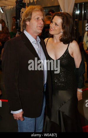 Sigourney Weaver and Jeff Daniels pose for photographers on the red carpet before the Toronto International Film Festival world premiere screening of 'Imaginary Heroes' at Roy Thomson Hall September 14, 2004  in Toronto, Canada. (UPI Photo/Christine Chew) Stock Photo