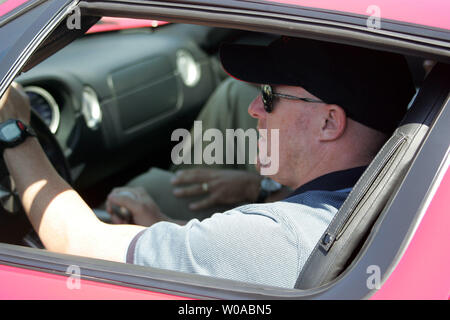 Forsythe team champ car driver Paul Tracy, of Toronto, arrives at the pit at Exhibition Place in the new Ford GT official pace car for the Toronto Molson Indy on July 7, 2005. The twentieth running of the Champ Car World Series race takes place on July 10th. Tracy is a two-time winner of the Toronto Indy race.  (UPI Photo / Grace Chiu) Stock Photo