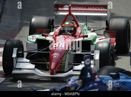 Brazilian driver Alex Sperafico takes the first turn dangerously close to Canadian driver Paul Tracy in the second champ car qualifying race at Exhibition Place for the Toronto Molson Indy on July 9, 2005. Sperafico later crashes, cutting short Tracy's bid to the pole position for the twentieth running of the Molson Indy on July 10th.  (UPI Photo / Grace Chiu) Stock Photo