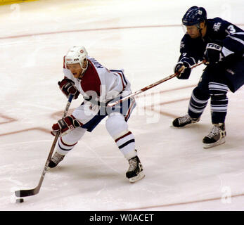 Montreal Canadiens captain Saku Koivu, of Finland, looks to pass the ...