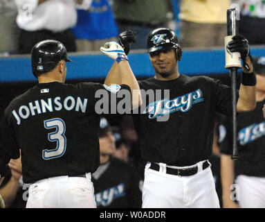 Toronto Blue Jays' Vernon Wells congratulates teammate Reed