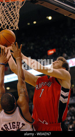 Toronto Raptors' Andrea Bargnani of Italy goes for a layup as New Jersey Nets' Antoine Wright tries to block during second quarter action at the Air Canada Center in Toronto, Canada on February 14, 2007. Bargnani scored 15 points on the night as the Raptors defeated the Nets 120-109. (UPI Photo/Christine Chew) Stock Photo