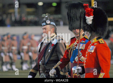 Britain's Prince Charles (wearing blue sash) attends the Royal Regiment of Canada and Toronto Scottish Regiment Presentation of Colours ceremony at Varsity Stadium in Toronto, Canada on November 5, 2009.  The Prince and his wife Camilla, Duchess of Cornwall, are on an 11-day tour of Canada.  UPI /Christine Chew Stock Photo
