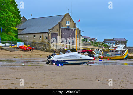 The RNLI Lifeboat station & slip way at Newquay in West Wales. Low tide. Boats rest on their keels. Stock Photo