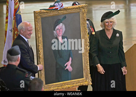 Camilla, the Duchess of Cornwall, unveils her official portrait on her inaugural visit as the new Colonel-in-Chief to the Queen's Own Rifles at Moss Park Armoury in Toronto, Canada on May 22, 2012. Camilla and her husband Prince Charles are on a four-day tour of Canada as part of Queen Elizabeth's Diamond Jubilee celebrations. UPI/Christine Chew Stock Photo