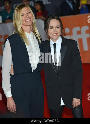 Ellen Page (R) and her girlfriend Samantha Thomas arrive at the world premiere of 'Freeheld' at Roy Thomson Hall during the Toronto International Film Festival in Toronto, Canada on September 13, 2015. Photo by Christine Chew/UPI Stock Photo