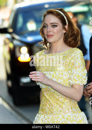 Emma Stone crosses the street after signing autographs for fans as she  arrives at the Toronto International Film Festival premiere of 'La La Land'  at the Princess of Wales Theatre in Toronto,
