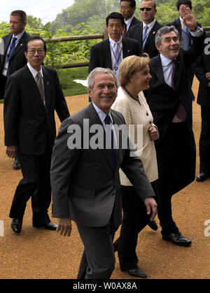U.S. President George W. Bush (C) with German Chancellor Angela Merkel, Prime Minister of Japan Yasuo Fukuda (L) and British Prime Minister Gordon Brown (R) leave after a tree planting ceremony at the Windsor Hotel Toya Resort and Spa during G8 Summit in Toyako, Japan on July 8, 2008. (UPI Photo/Alex Volgin) Stock Photo