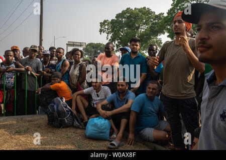 Migrants from Haiti, Africa, Middle East and Asia wait in front of (INM) Instituto Nacional de Migración Delegación Federal en Chiapas in Tapachula, Mexico for their number to be called on May 6, 2019.  Once their number is called migrants are able to start the process for an exit Visa that is valid for 20 days.     Photo by Ariana Drehsler/UPI Stock Photo