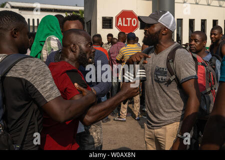Migrants argue in front of (INM) Instituto Nacional de Migración Delegación Federal en Chiapas in Tapachula, Mexico on May 6, 2019. Tension has been building due to the length of time it is taking to start the process for an exit Visa.    Photo by Ariana Drehsler/UPI Stock Photo
