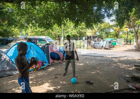 Children play outside in Tapachula, Mexico on May 8, 2019.  Migrants from Africa and Haiti have temporarily settled near (INM) Instituto Nacional de Migración Delegación Federal en Chiapas while hoping to apply an exit visa so they can make their way to the US-Mexico border.  Photo by Ariana Drehsler/UPI Stock Photo