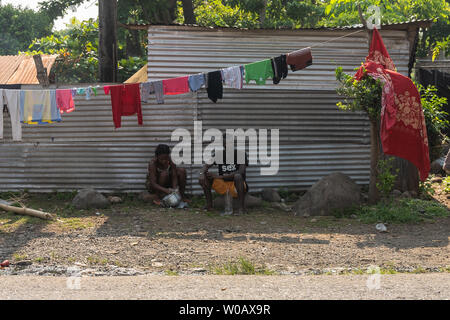 A man and woman sit underneath a clothes line in Tapachula, Mexico on May 9, 2019.  Migrants from Africa and Haiti have temporarily settled near the (INM) Instituto Nacional de Migración Delegación Federal en Chiapas building while hoping to apply for an exit visa so they can make their way to the US-Mexico border.  Photo by Ariana Drehsler/UPI Stock Photo