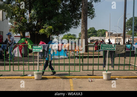Migrants wait in front of (INM) Instituto Nacional de Migración Delegación Federal en Chiapas in Tapachula, Mexico for their number to be called on May 9, 2019.  Once their number is called migrants are able to apply for an exit visa that is valid for 20 days.     Photo by Ariana Drehsler/UPI Stock Photo
