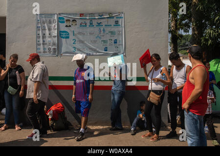 Migrants wait in line to apply for an exit visa or a regional visitor visa in front of (INM) Instituto Nacional de Migración Delegación Federal en Chiapas office in Tapachula, Mexico on May 9, 2019. Photo by Ariana Drehsler/UPI Stock Photo